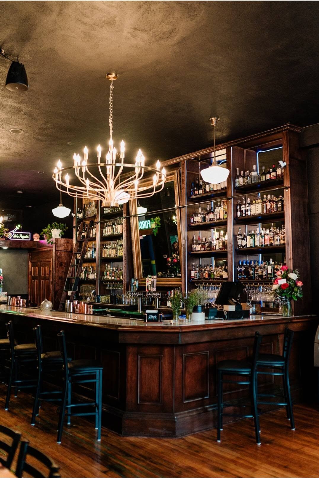 Borracho's bar interior with chandelier and back bar