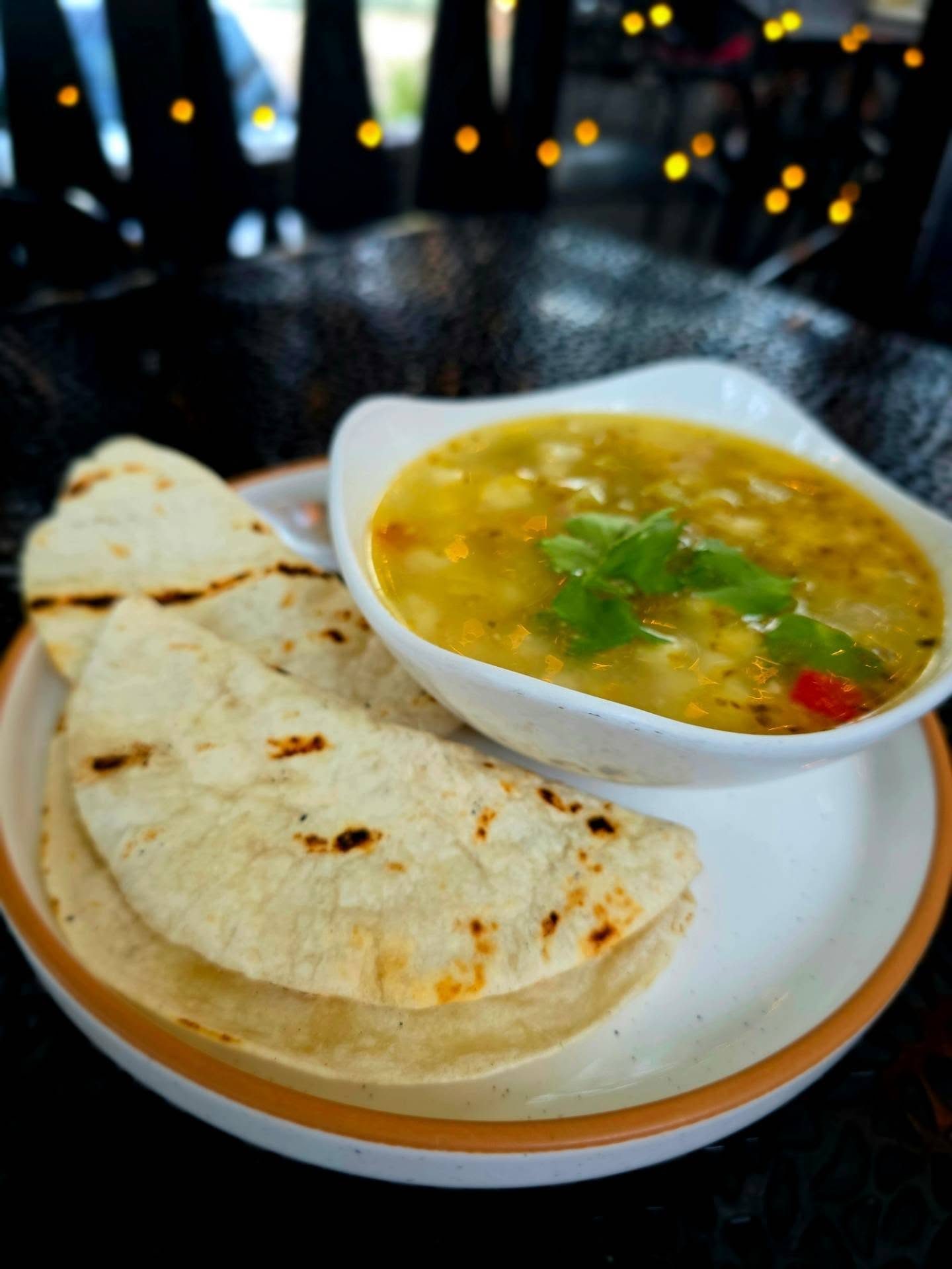 Posole Verde special at Borracho's: hominy, local green chile pork sausage, green chile, onion and cilantro, served with grilled tortillas. $6 cup, $12 bowl